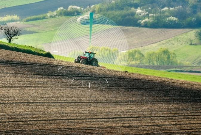 Tractor in a field with a clock figure embedded